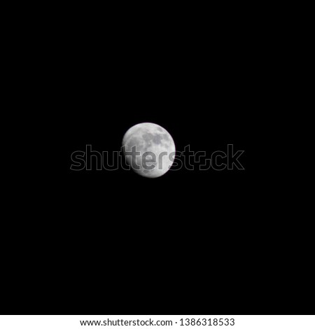 Moon pictured during night time.