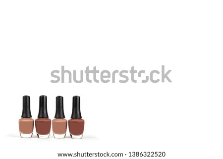Nail polish bottles on white background for wallpaper.  Concept of beauty,  fashion.