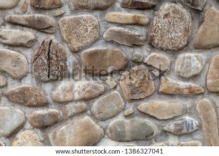 medieval wall with pebbles and italy rock europe