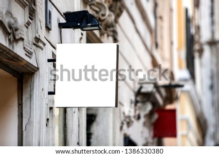 Square blank signboard on the street in the city - Image