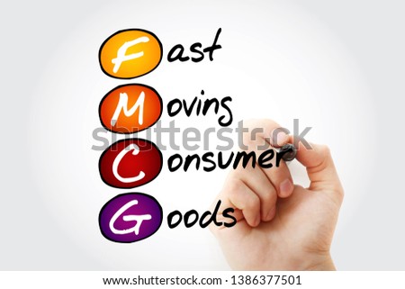 Hand writing FMCG - Fast Moving Consumer Goods acronym with marker, concept background