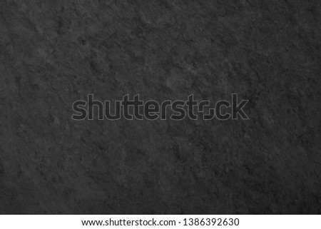 Dark grey black slate background or texture, stone wall surface.