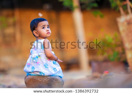 cute indian baby girl  playing in the park