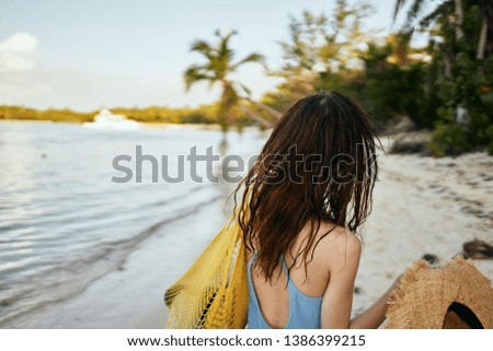  woman with bag on the beach ocean summer                              