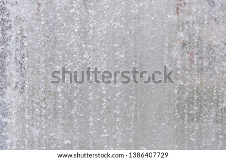 Stop motion with high speed shutter of splashing water at the fountain, Water texture, Nature background.