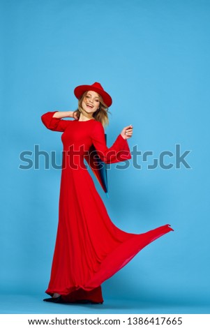   woman in red dress with hat fashion style studio                             