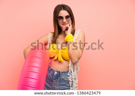 Young woman in bikini in summer holidays thinking an idea