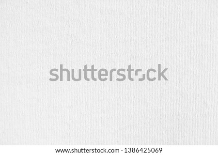 Closeup white cotton fabric texture background. Royalty-Free Stock Photo #1386425069