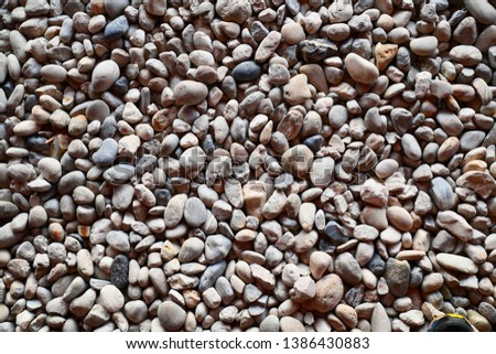 Sea stones background , round stone background texture.