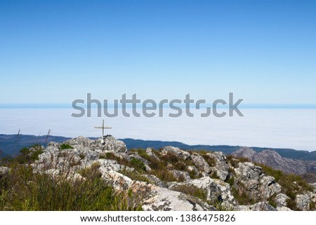 A wooden cross on top of Formosa mountain peak near Plettenberg Bay, South Africa. Christianity religion concept image. 