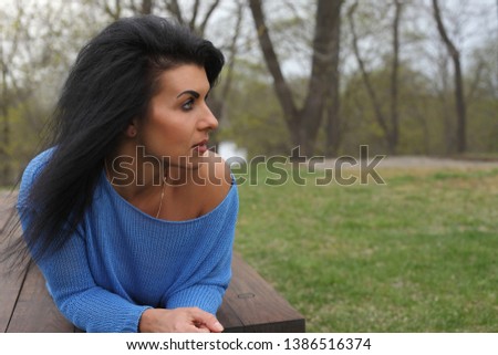 portrait young beautiful woman in the park