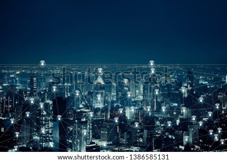 The abstract image of wireless network and wifi connection technology concept with bangkok city background at night in Thailand
