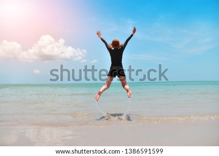 Women jumping on beach at sea and Blue sky
