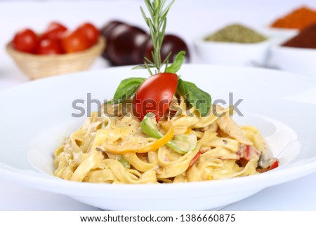 Fettucine pasta white cream sauce in plate