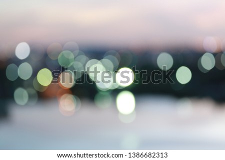 abstract exposure of blurred sky night city downtown construction with circle round light background with bokeh.