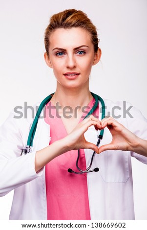 young doctor showing heart sign