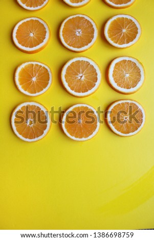 It is a photograph of oranges cut in close-up