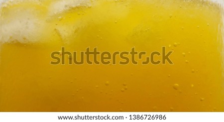 Background Close Up, fresh yellow bubble from dropped vitamin c  into water at glass