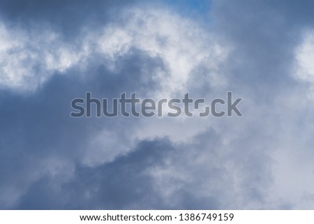 Gray overcast cloudy sky over horizon. Closeup clouds