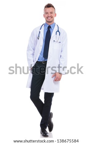 full body picture of a young doctor looking at the camera