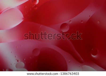Blurred abstract background. Red with white circles and wavy lines of different sizes. Cropped shot, horizontal, a lot of free space, nobody. The concept of design.