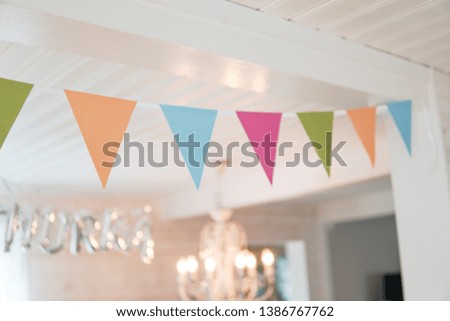 Celebration banner of party flags in different color
