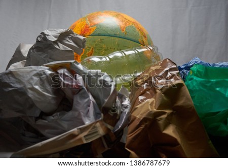 Globe lit with plastic garbage