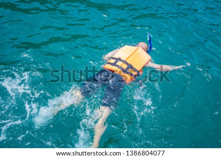 Man snorkeling in a sea