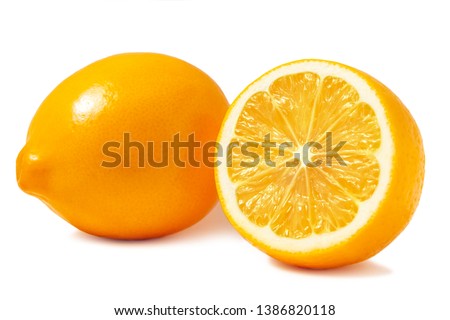 Fresh orange Tashkent lemons or Meyer lemons, one whole and one half isolated on white background with shadow Royalty-Free Stock Photo #1386820118