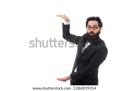 portrait of surprised bearded businessman holding two hands in front of him and shows the size, image isolated white background