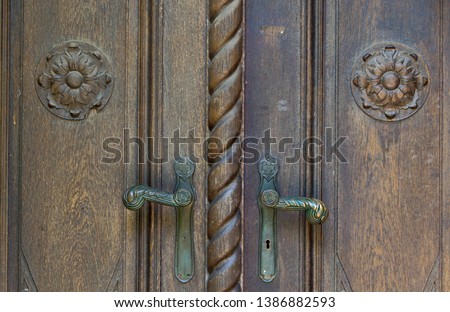 Closed old brown wooden door. Ancient, historic, abstract - image