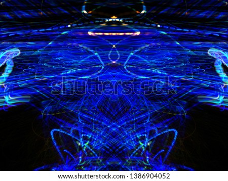 Light effects. Neon glow. Symmetry and reflection. Abstract blurred background. Colorful pattern. Texture.