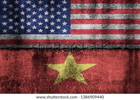 two flags on a cracked wall, USA and Vietnam
