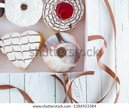 donuts in a box on a light background