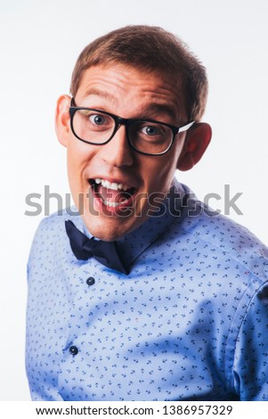 Portrait of handsome smiling guy over white background studio shot