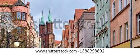 Panoramic image city of Legnica, one of the oldest cities in southwestern Poland, central part of Lower Silesia, steeple of Roman Catholic Diocese ancient architecture central street in Poland
