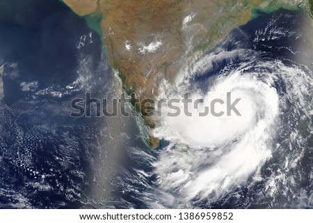 Cyclone Fani heading towards India in 2019 - Elements of this image furnished by NASA  Royalty-Free Stock Photo #1386959852