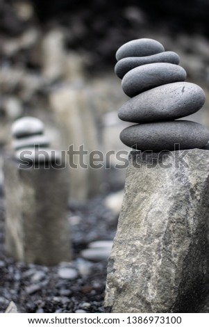 Two cairns located at black sand beach in Reynisfjara Iceland