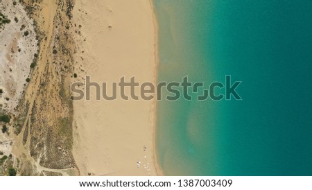 Top View Of Beach Sand & Sea In North Cyprus. Beautiful meeting between mediterranean sea and beach sand from the birds eye view shot with drone