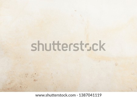 Vintage and antique background frame art concept. Front view of blank old aged dirty photo paper texture with stains and scratches. Detailed closeup studio shot
