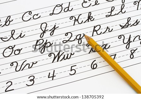 Example of cursive writing with a pencil, Learning cursive writing Royalty-Free Stock Photo #138705392