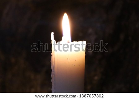 Burning candle in the Temppeliaukion Church (Rock Church), Helsinki, Finland.
