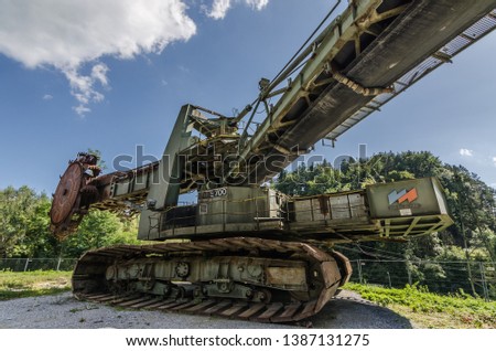 Wide angle view of a bucket wheel excavator in the mountains
