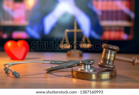 Stethoscope with judge gavel. Concept of healthcare and medicine, malpractice, legal system.