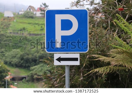 Traffic sign parking with direction arrow
