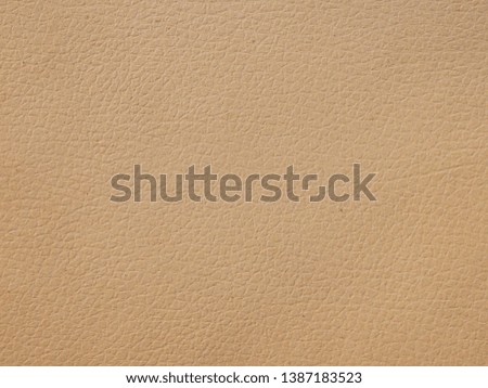 Seamless brown leather texture background surface closeup.