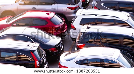 Car parked at concrete parking lot of shopping mall in holiday. Aerial view of car parking area of the mall. Automotive industry. Automobile parking space. Global automobile market concept. Royalty-Free Stock Photo #1387203551