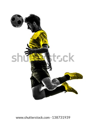 one brazilian soccer football player young man heading in silhouette studio isolated on white background