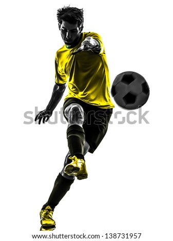 one brazilian soccer football player young man kicking in silhouette studio isolated on white background