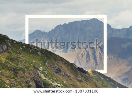 White rectangle in the middle of cloudy mountain landscape. Natural and unkown. UFO landscape.